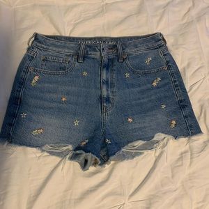 These are size 6 American Eagle jean shorts! They are blue with flowers!
